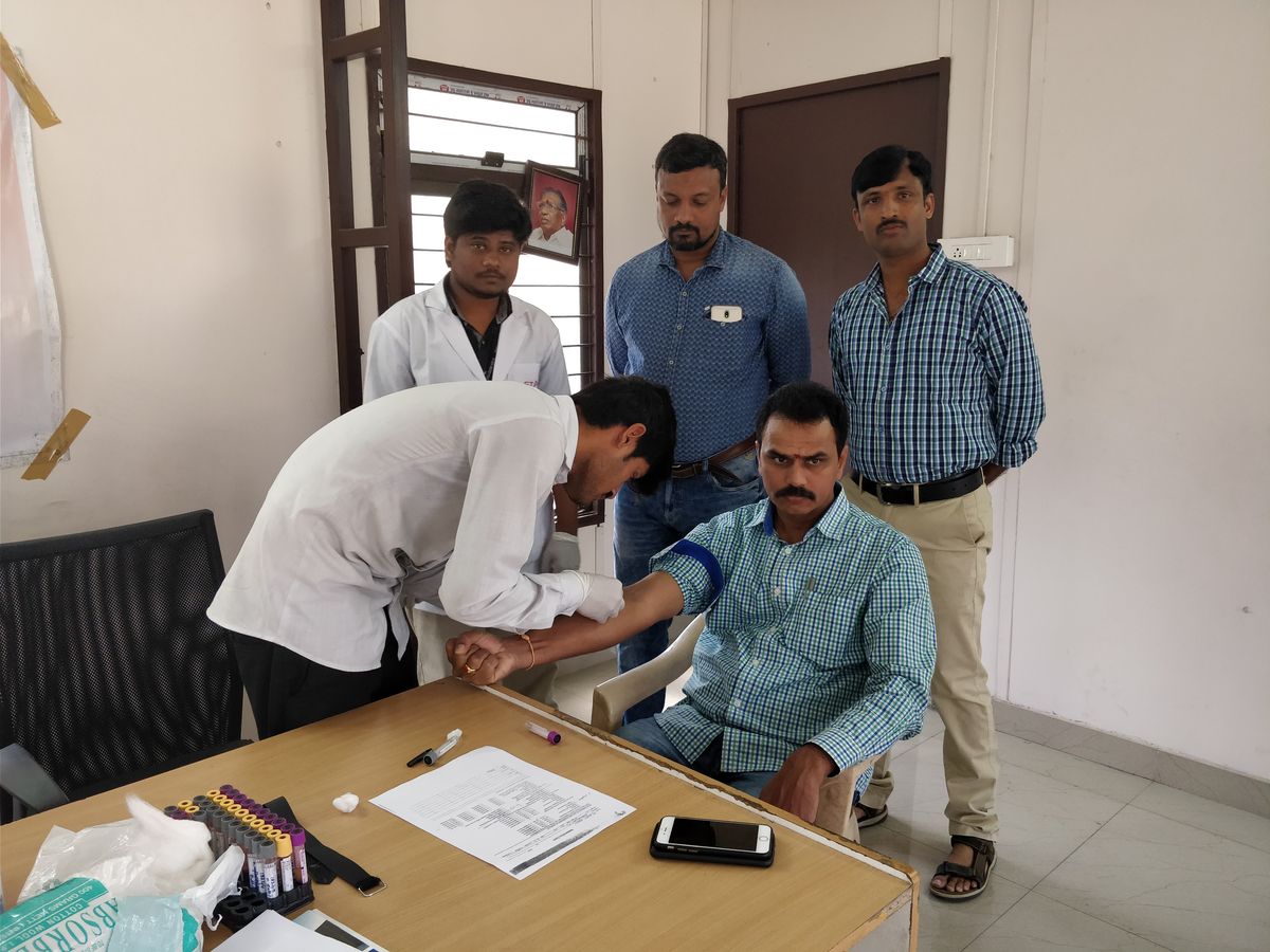 Blood sample collection at a CFYKF screening camp